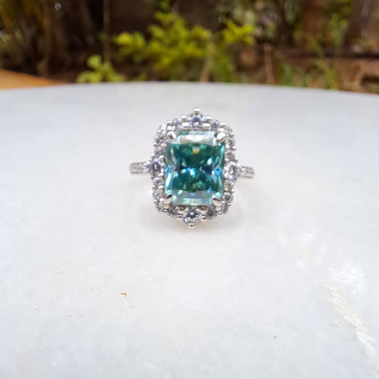 Teal Moissanite and Sapphire Halo Ring by Vai Ra
