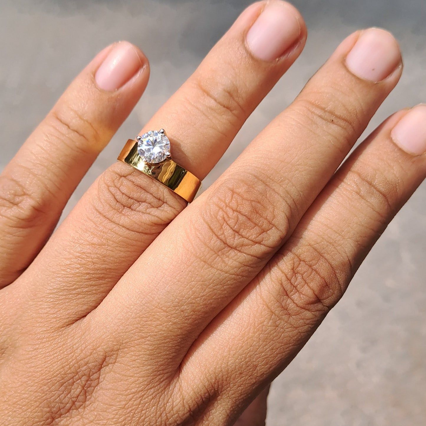 Grace your finger with the timeless elegance of the Aubrey Solitaire Band Ring. Crafted to perfection, this ring features a dazzling solitaire diamond set in a sleek band, symbolizing everlasting love and commitment. Whether worn as a promise ring or a chic accessory, the Aubrey ring exudes sophistication and grace, making it a cherished piece for every modern woman.