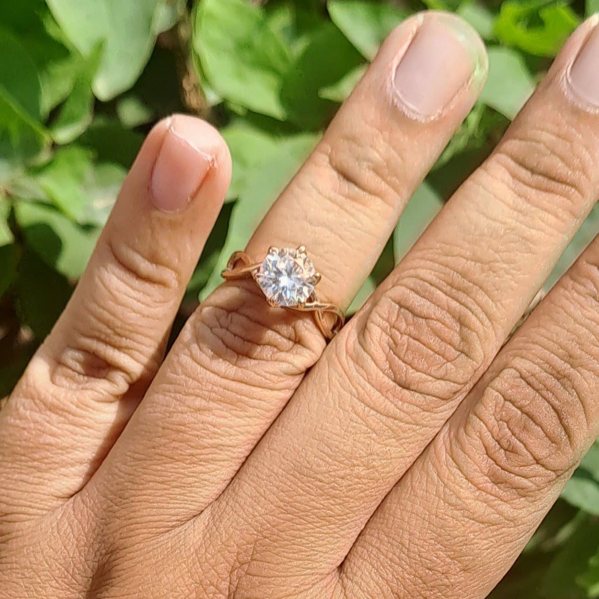 Step into a realm of enchantment with our Narnia Ring, where timeless elegance meets whimsical charm. At its heart lies a captivating solitaire, cradled delicately in tulip prongs, radiating brilliance and grace. The band, intricately designed with an infinity pattern, symbolizes eternal love and infinite possibilities.