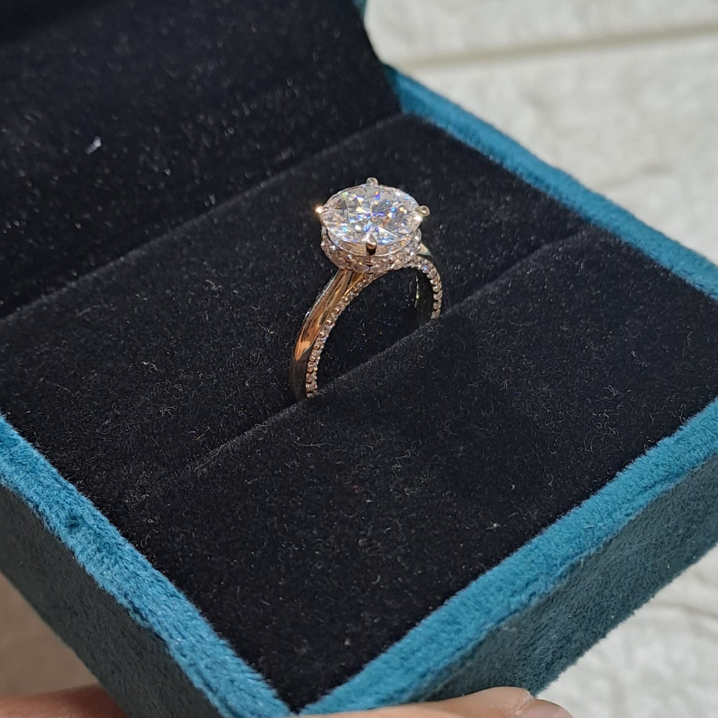 Elevate your love story to new heights with our mesmerizing solitaire ring featuring a breathtaking 2-carat center stone, accented by dazzling side stones.