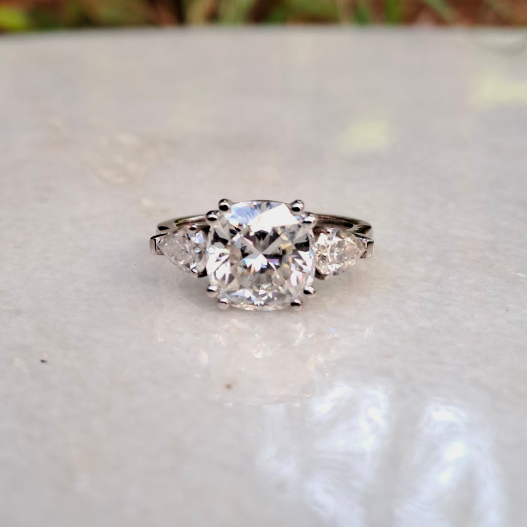 Moissanite diamond threestone engagement ring
