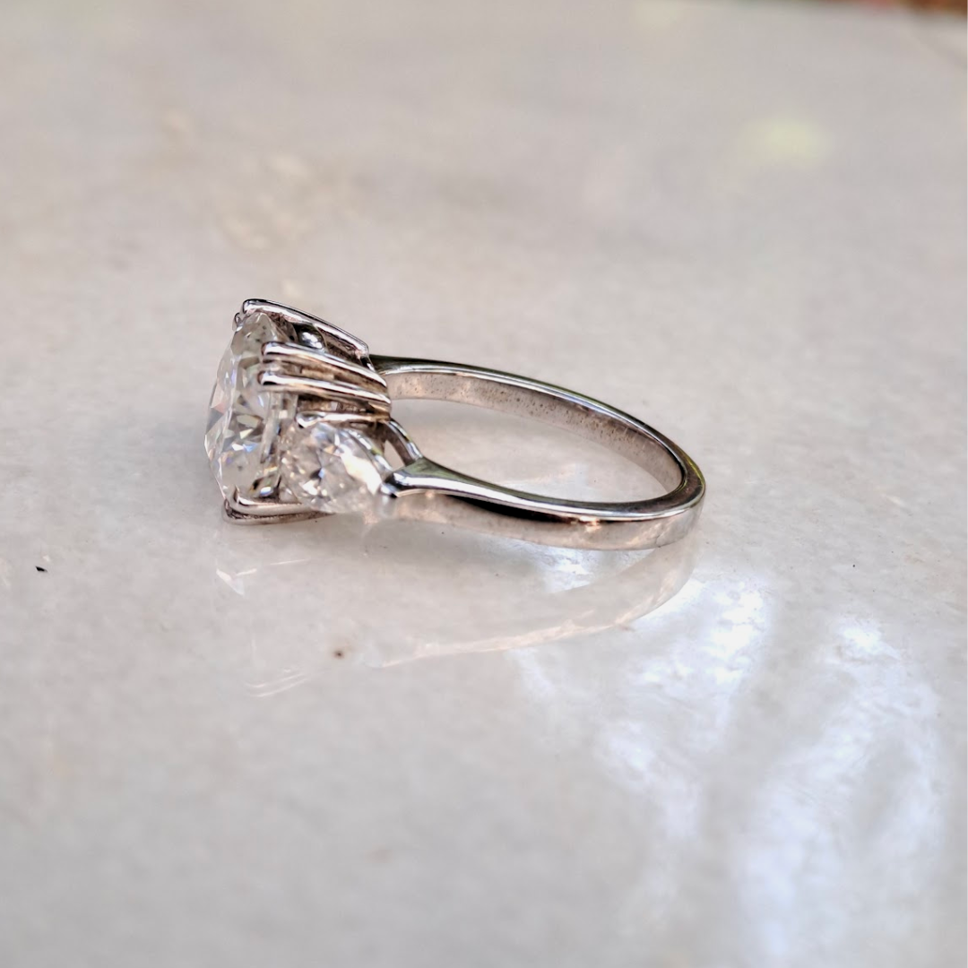 Moissanite diamond threestone engagement ring