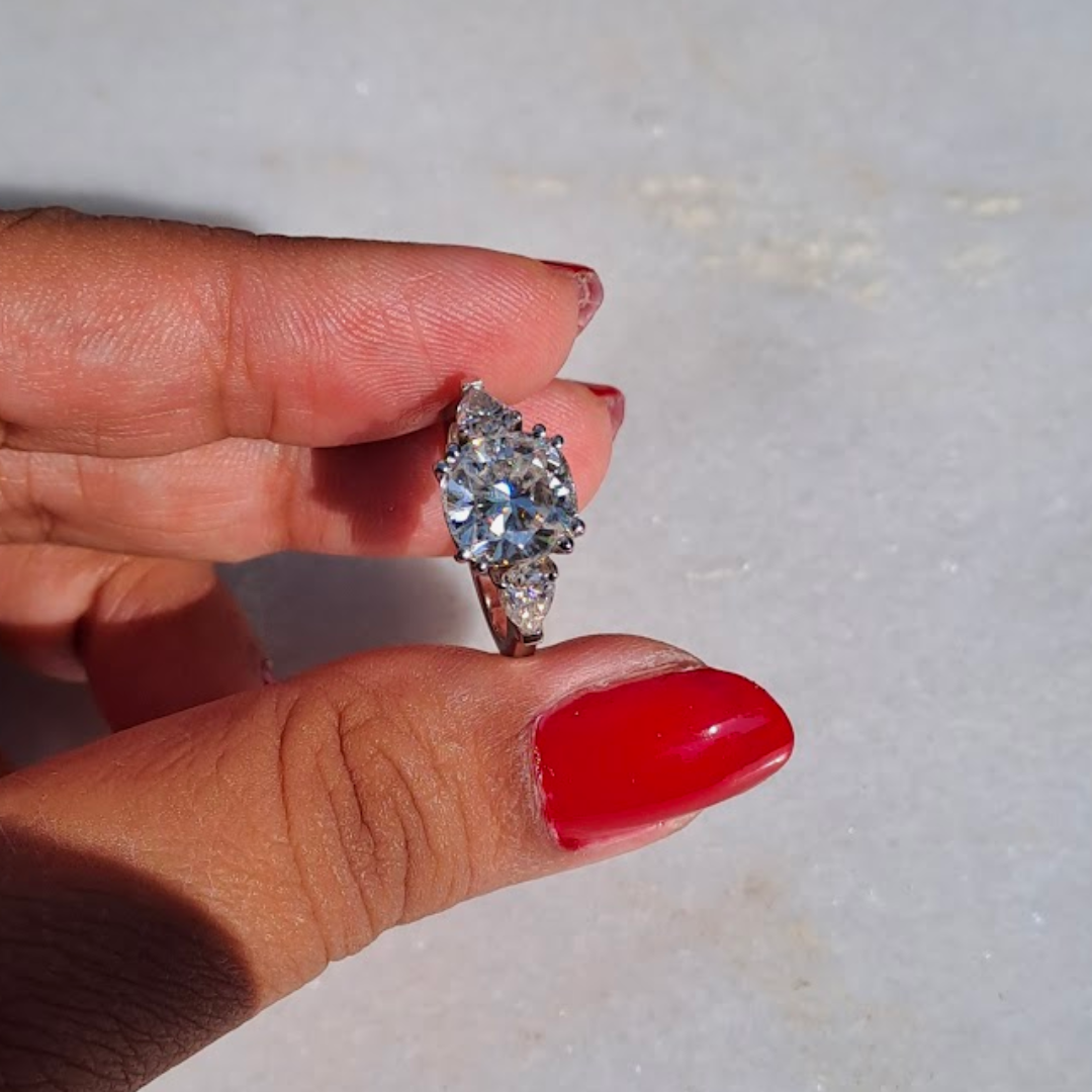 Moissanite diamond threestone engagement ring