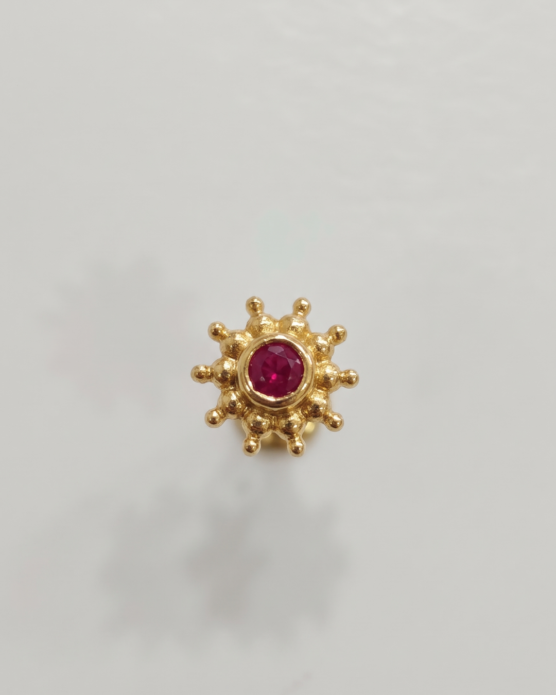 Ruby Nosepin and helix piercing