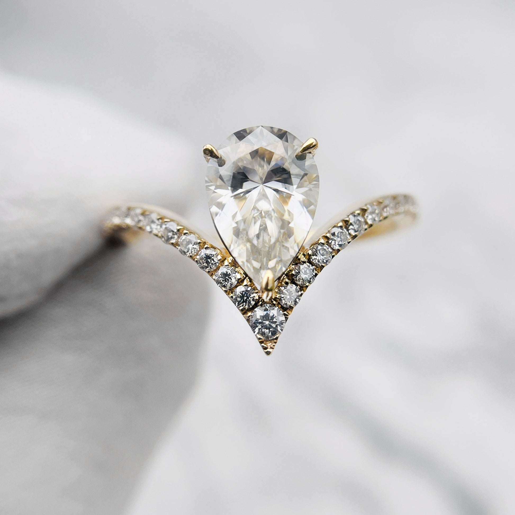 Pear Moissanite Ring in Silver and Gold